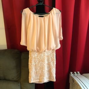 Pale peach colored dress.  Short/mid length.